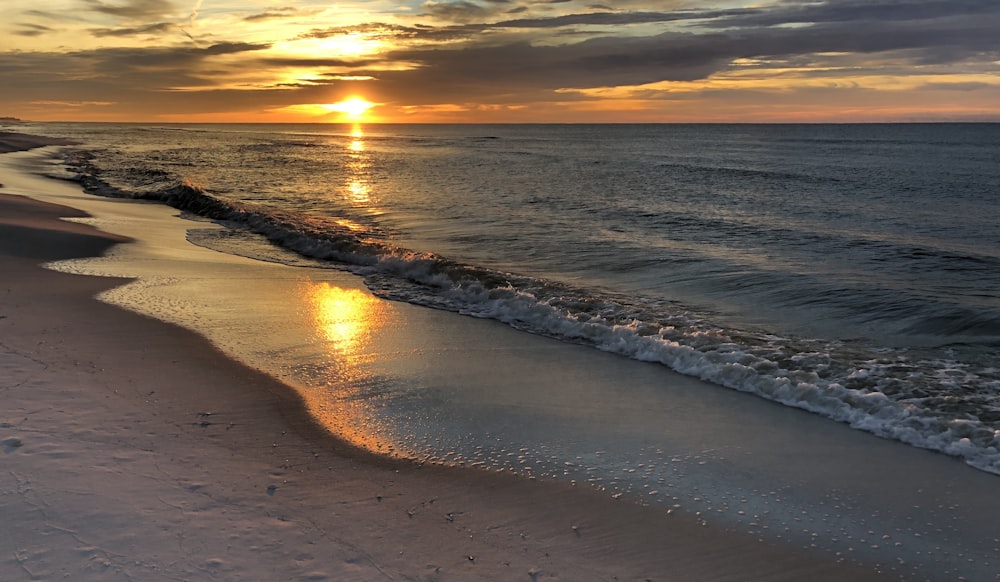 calm sea and shore under golden hour