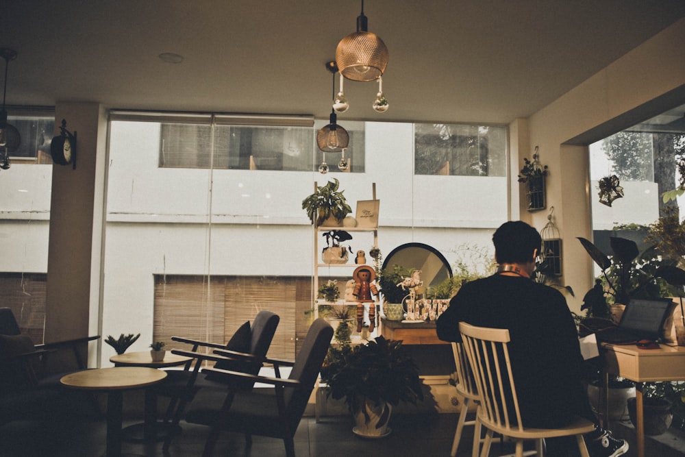 person sitting near table inside room