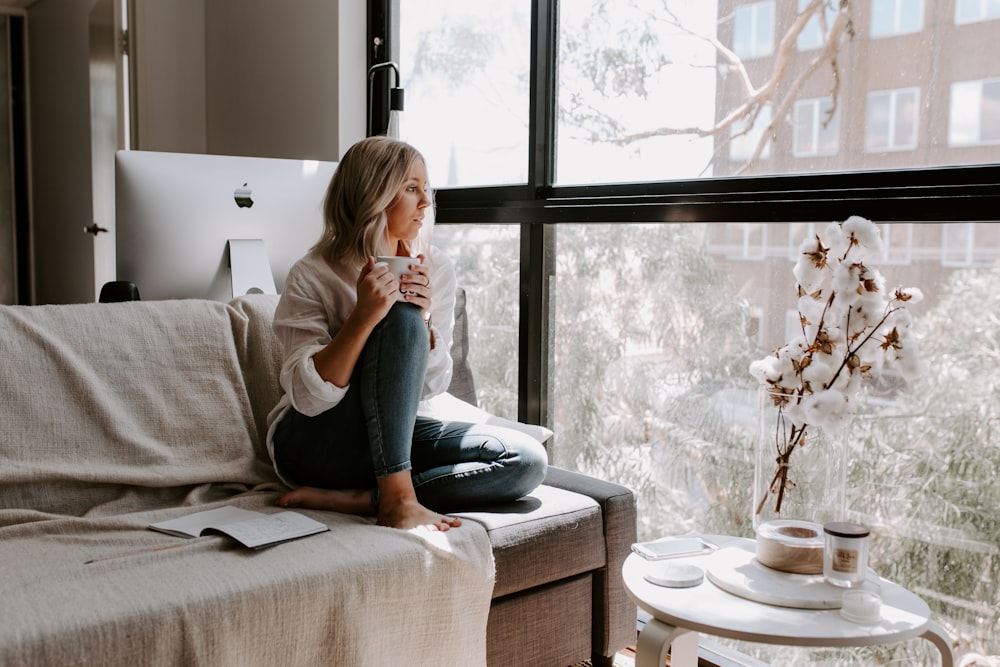 woman sitting on sofa