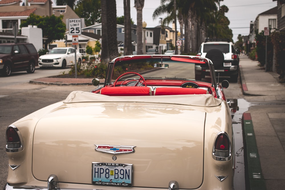 classic beige Chevrolet convertible coupe parked on street