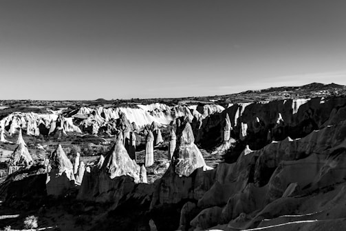 A dramatic alien landscape with strange rock formations.