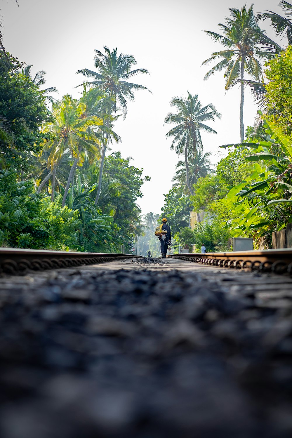 man walking on rail