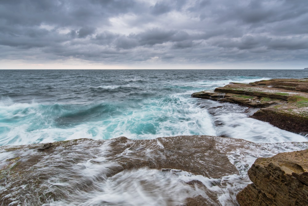 beach under nimbus clouds