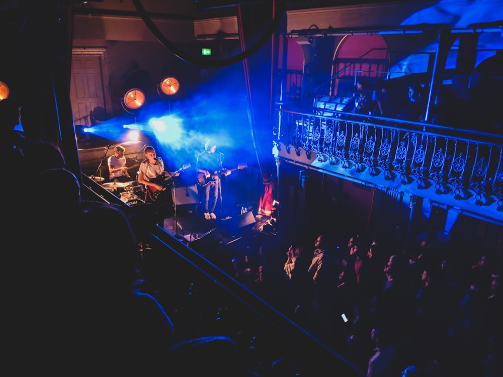 band group performing with crowding people