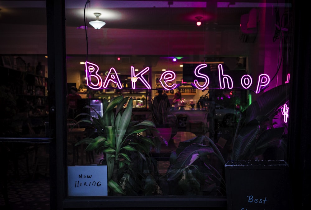 purple Bake Shop signage at night