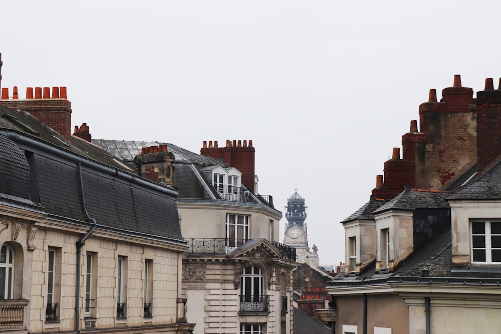 white and black buildings under grey sky