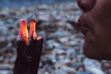 Artist carefully burning wood to create a lifelike portrait.