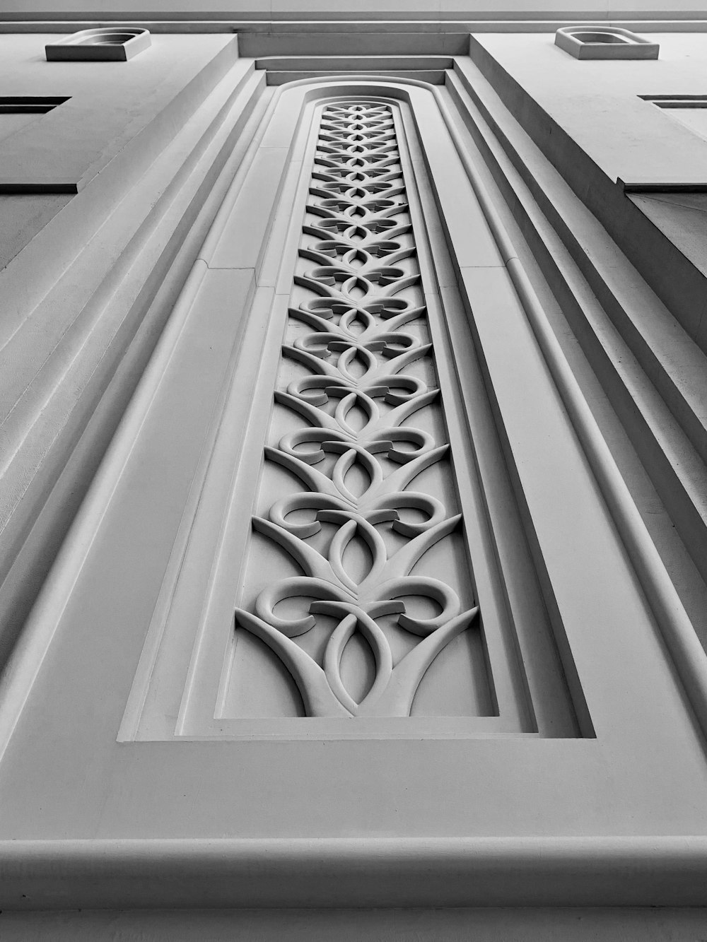low-angle photography of white concrete building