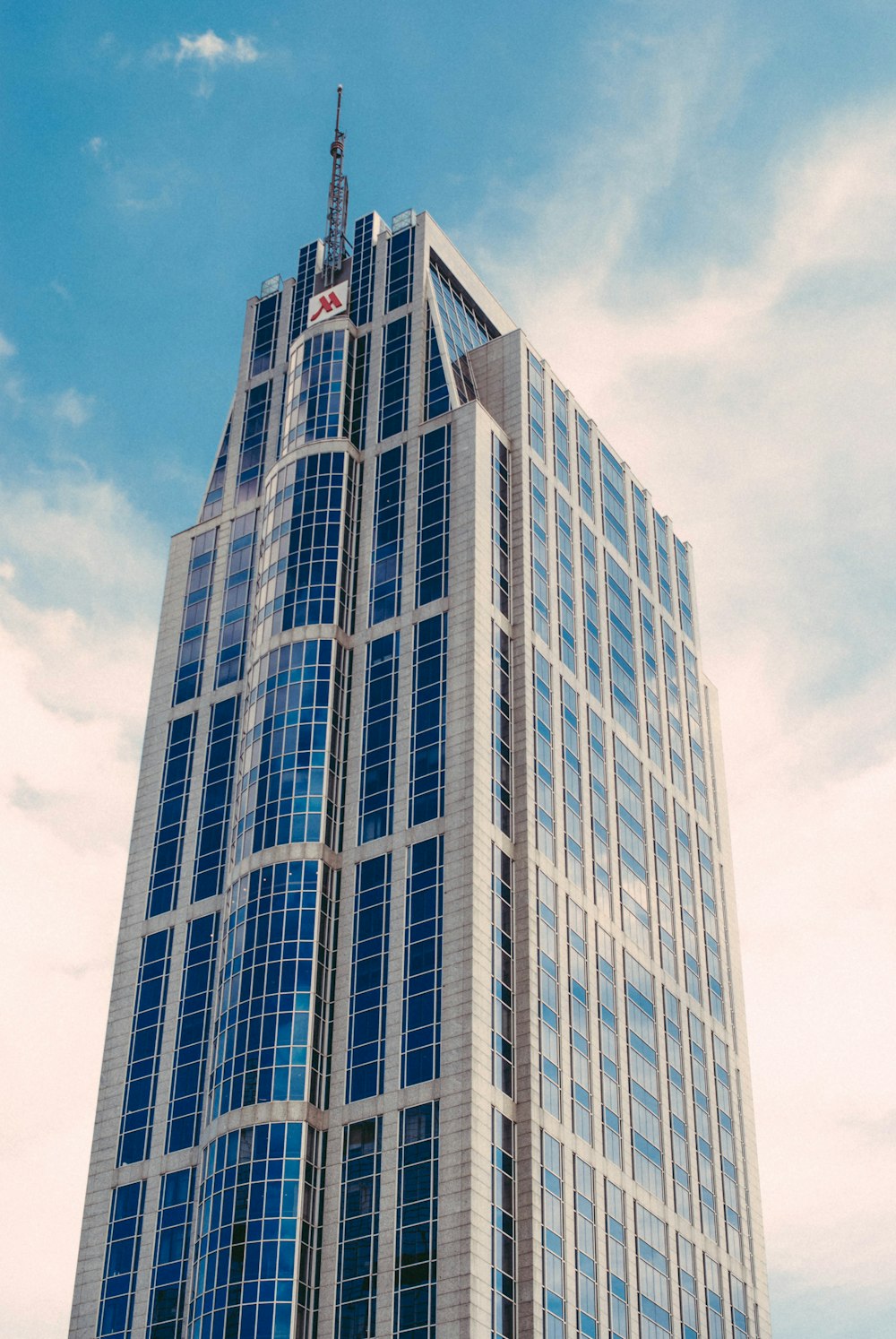 low-angle photography of curtain wall building