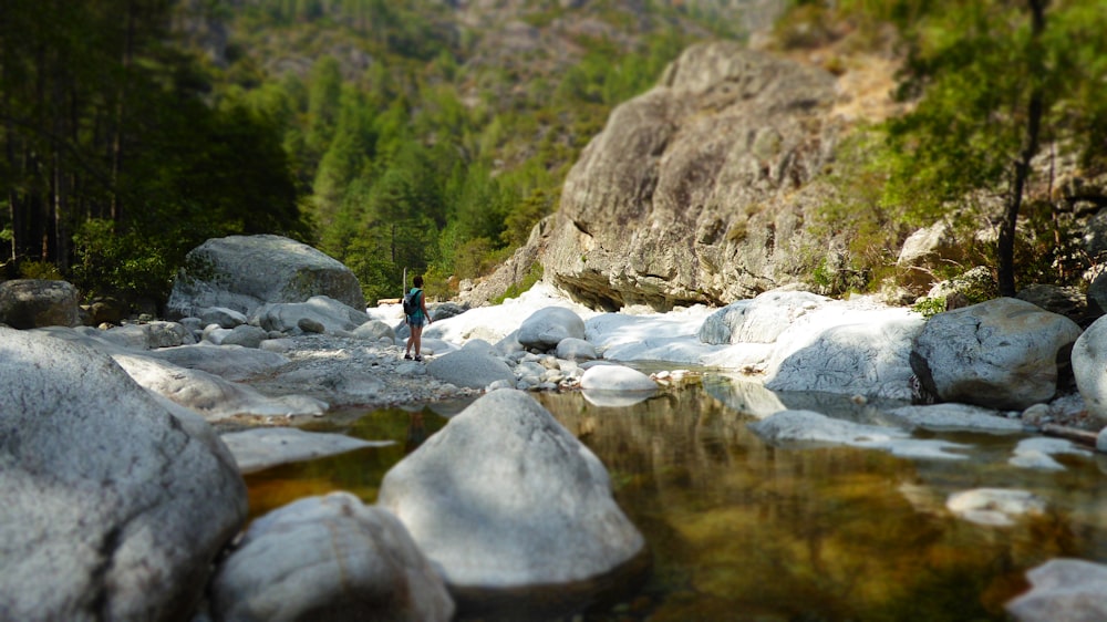 person walking in river