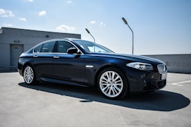 black BMW sedan on focus photography