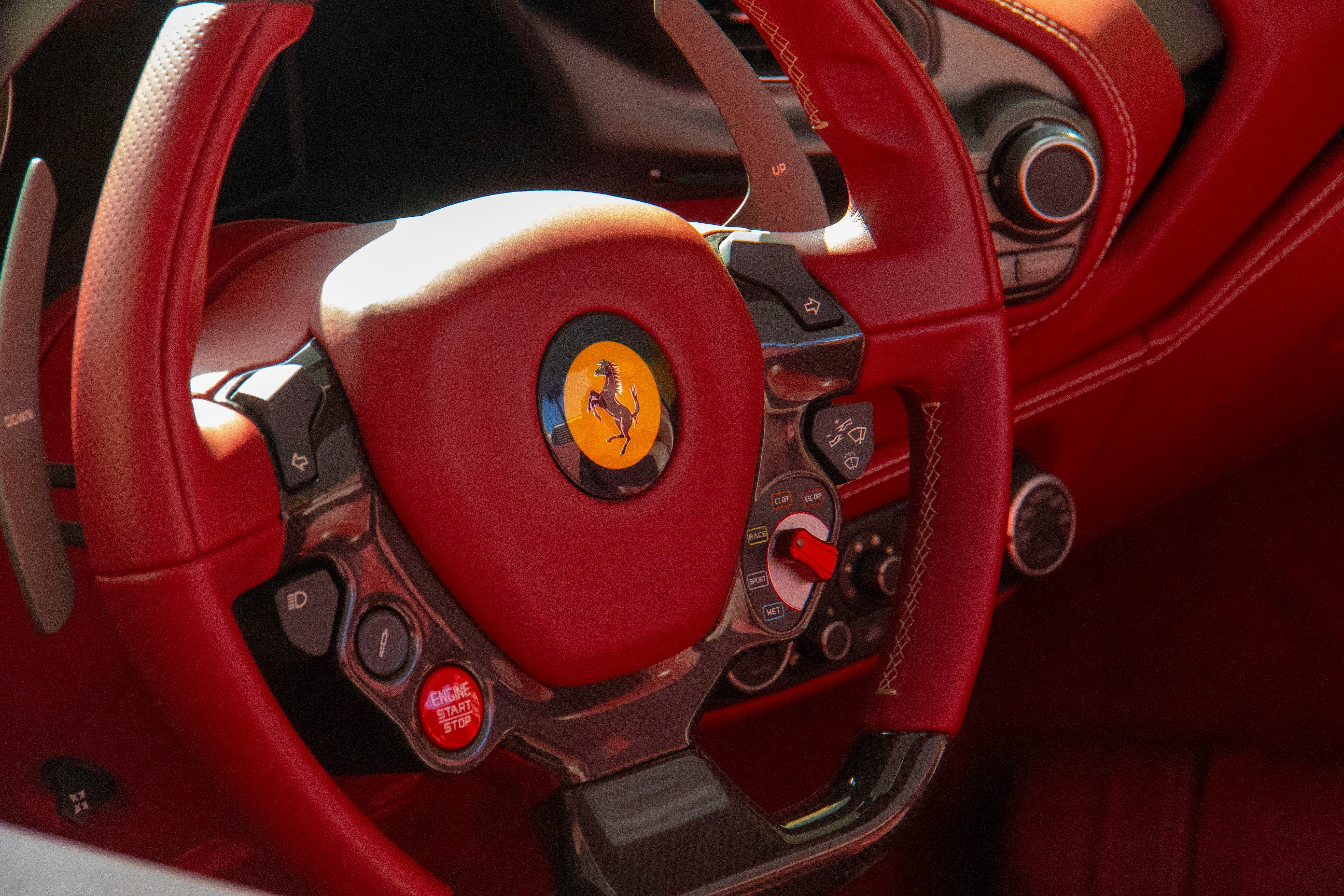 red and black Ferrar steering wheel close-up
