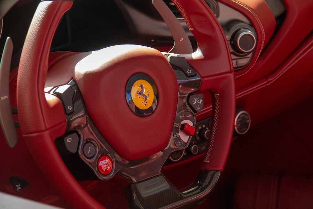 red and black Ferrar steering wheel close-up