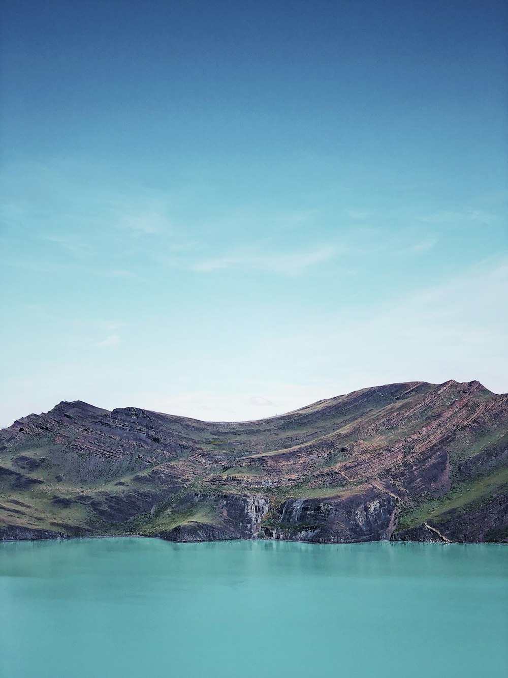 blue lake on mountain slope