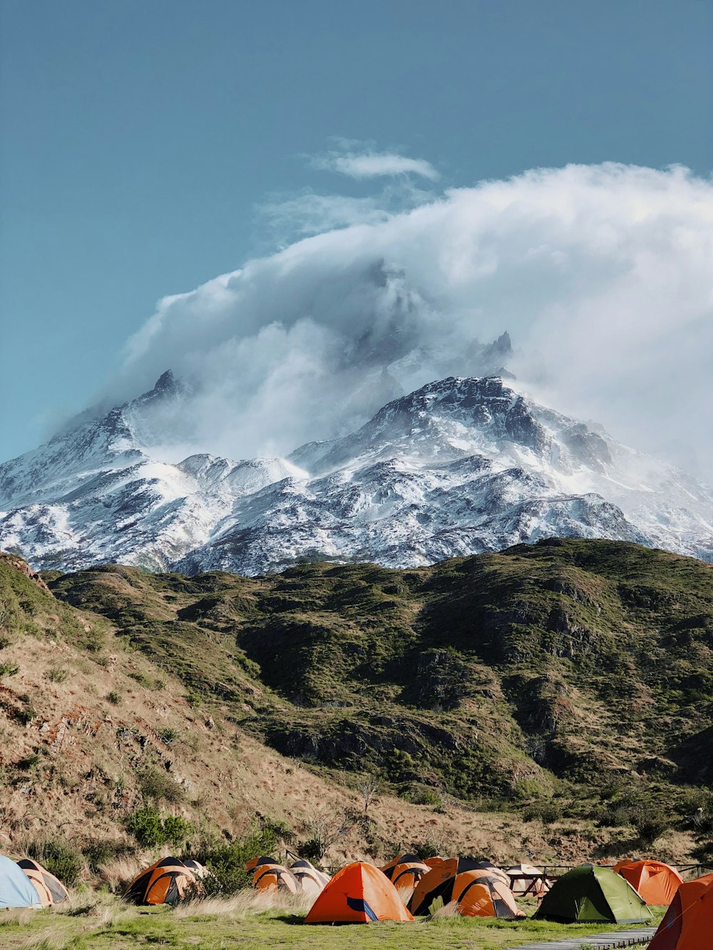 tents by the mountain