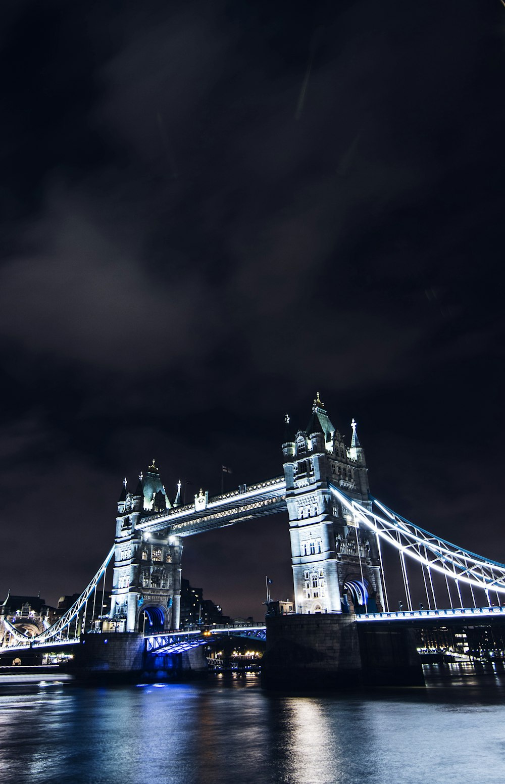 lighted tower bridge at night