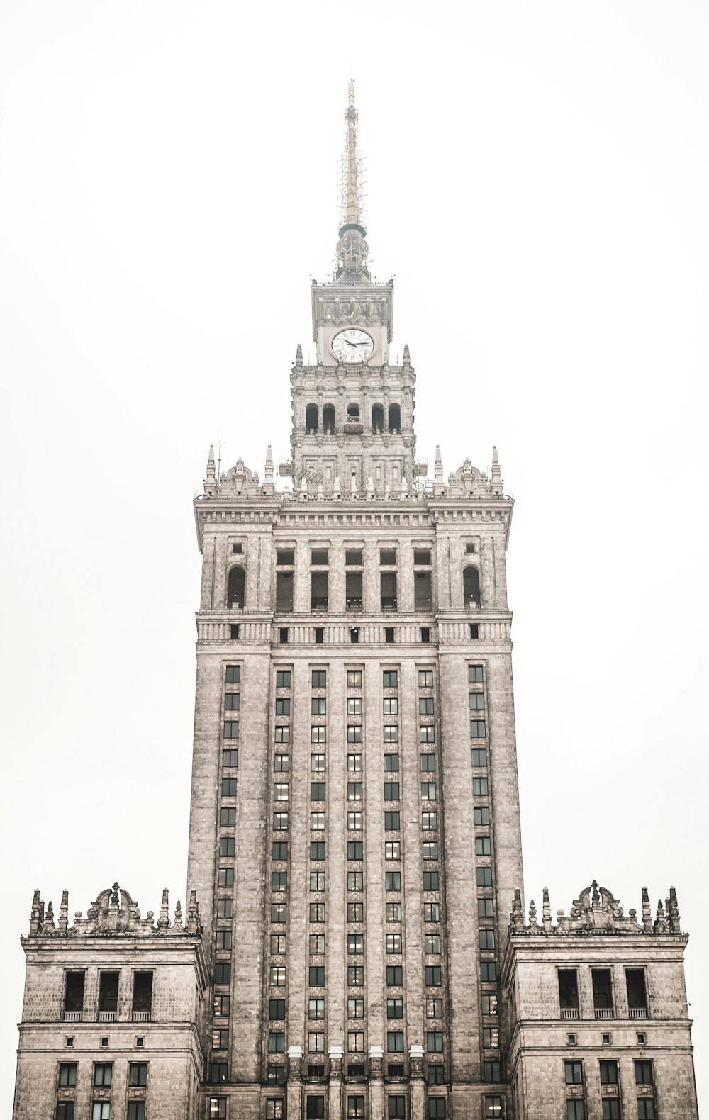 gray concrete tower clock under white sky