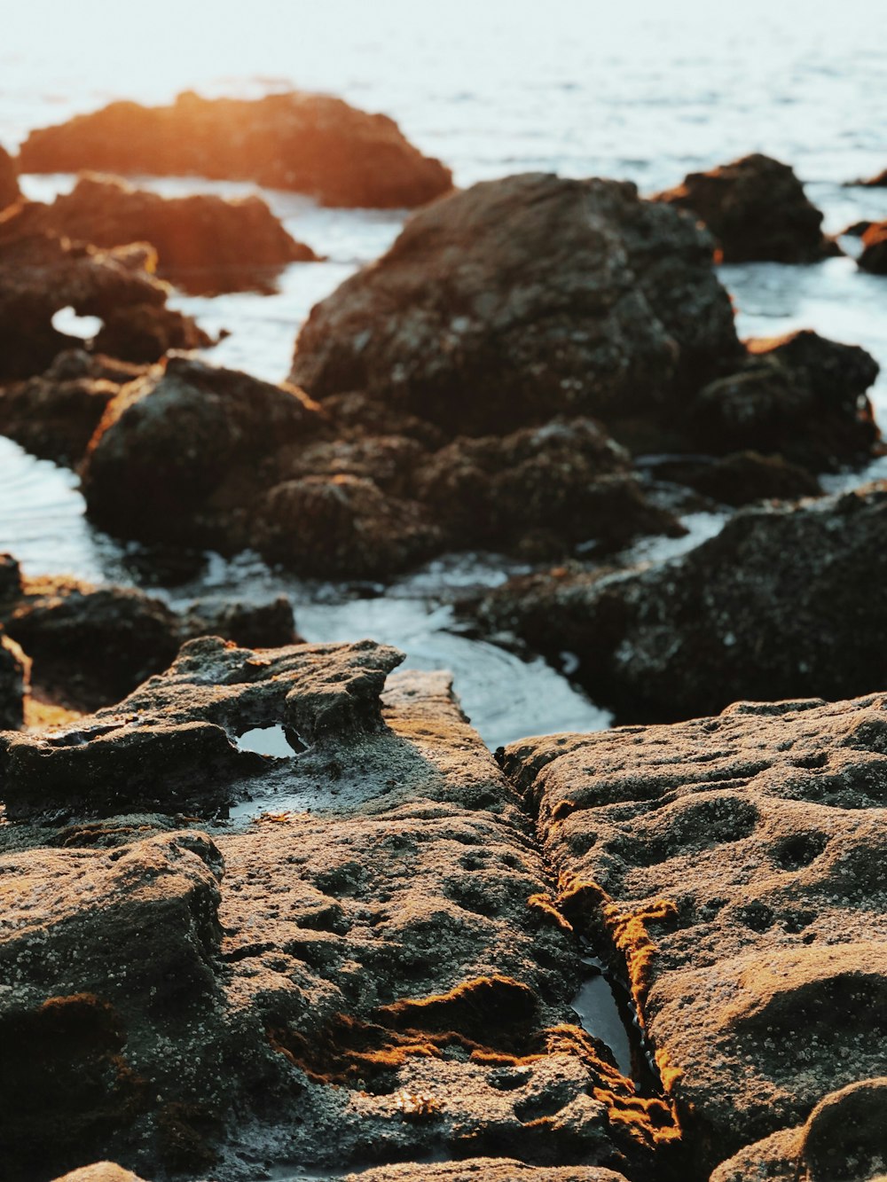 body of water and stones