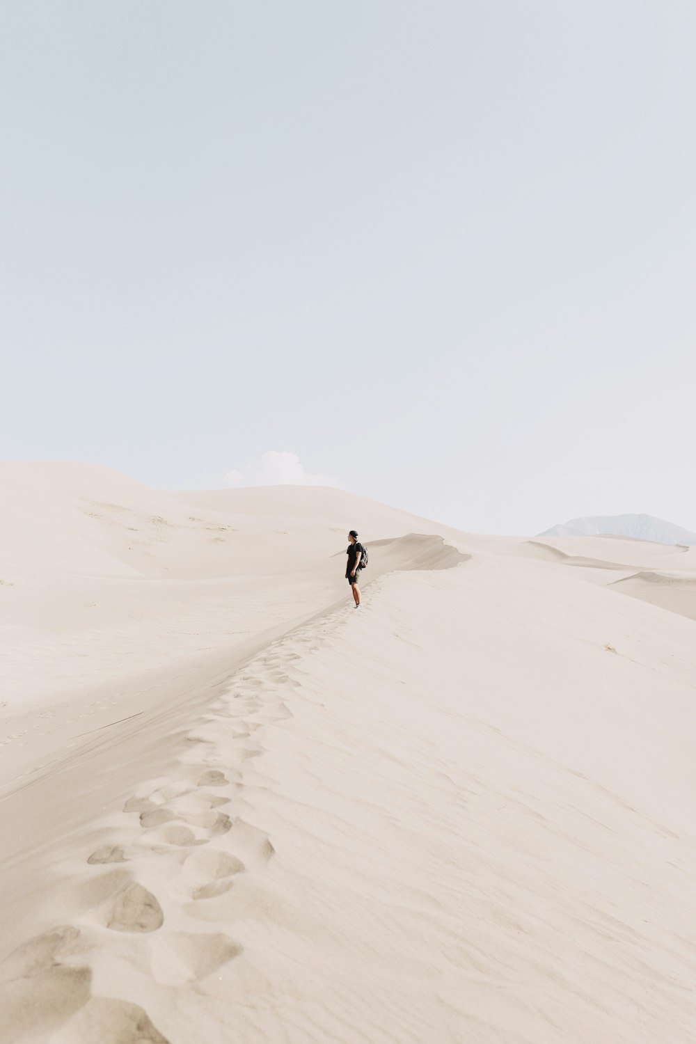 person standing on sand