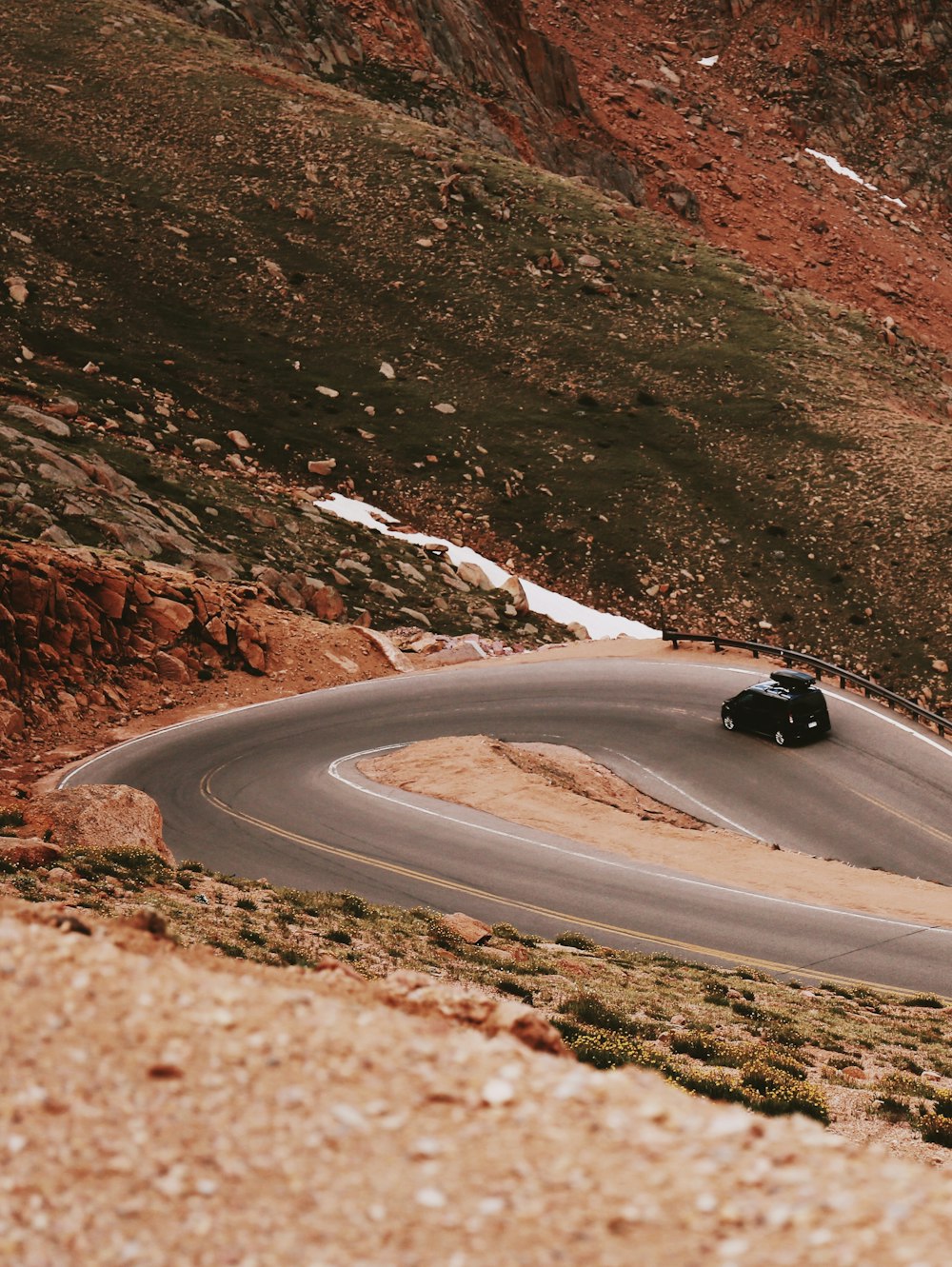 black vehicle on road at daytime