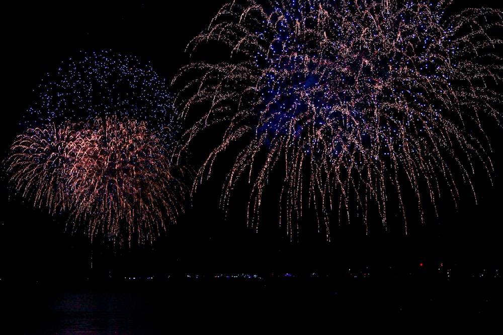 time-lapse photography of bursting fireworks in sky during nighttime