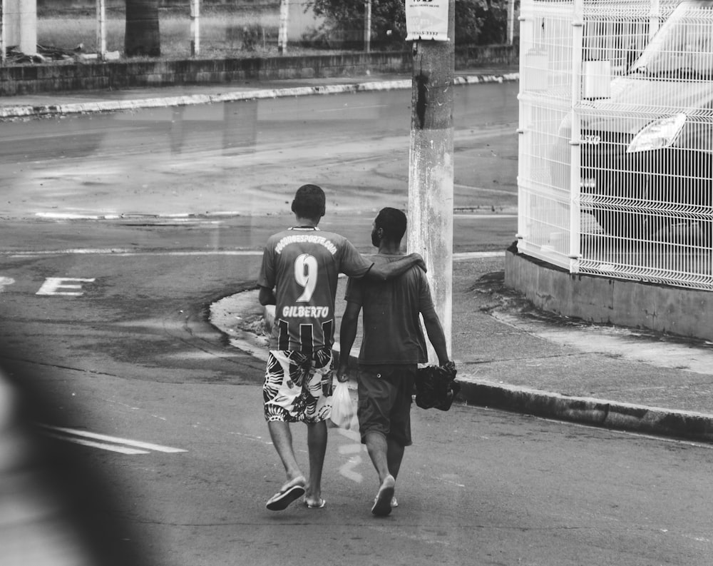 two men walking on street