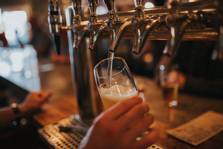A pint being filled at the tap wall