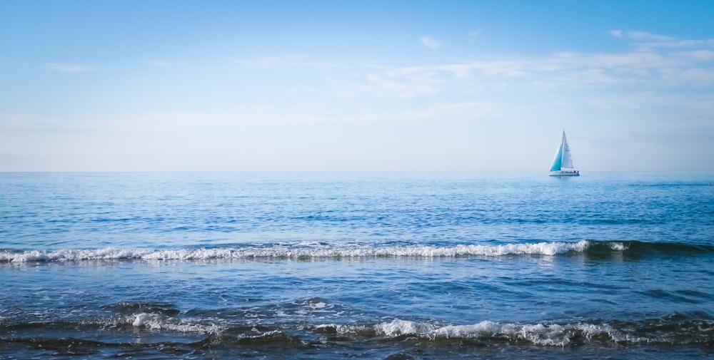 sailboat on sea water on daytime