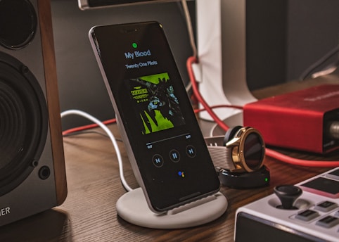 charging smartphone beside smartwatch