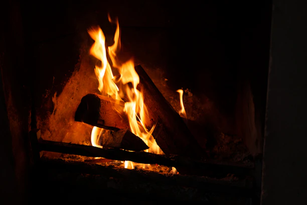 A crackling fire inside the cabin casting warm shadows on wooden walls.
