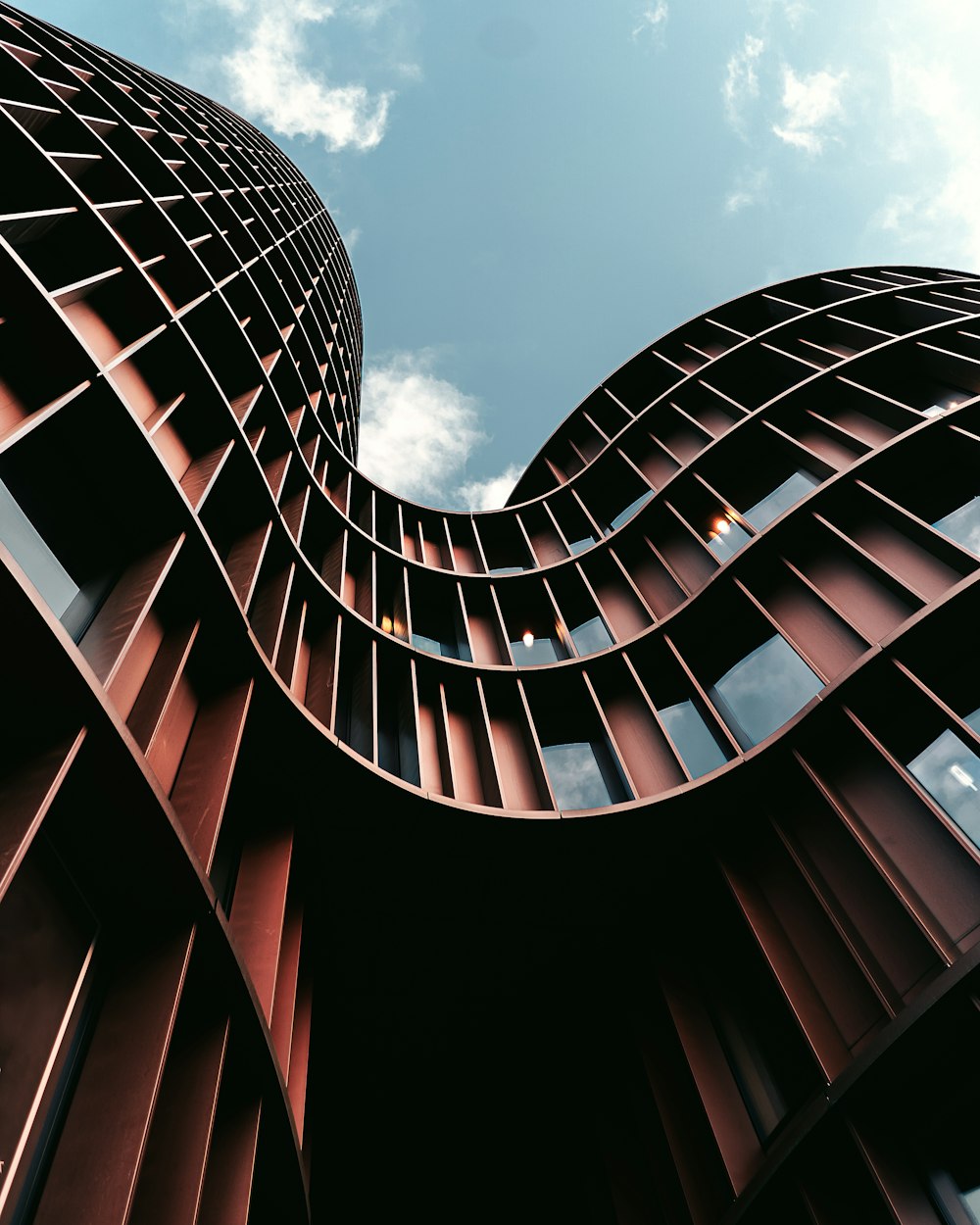 low-angle photography of brown building during daytime