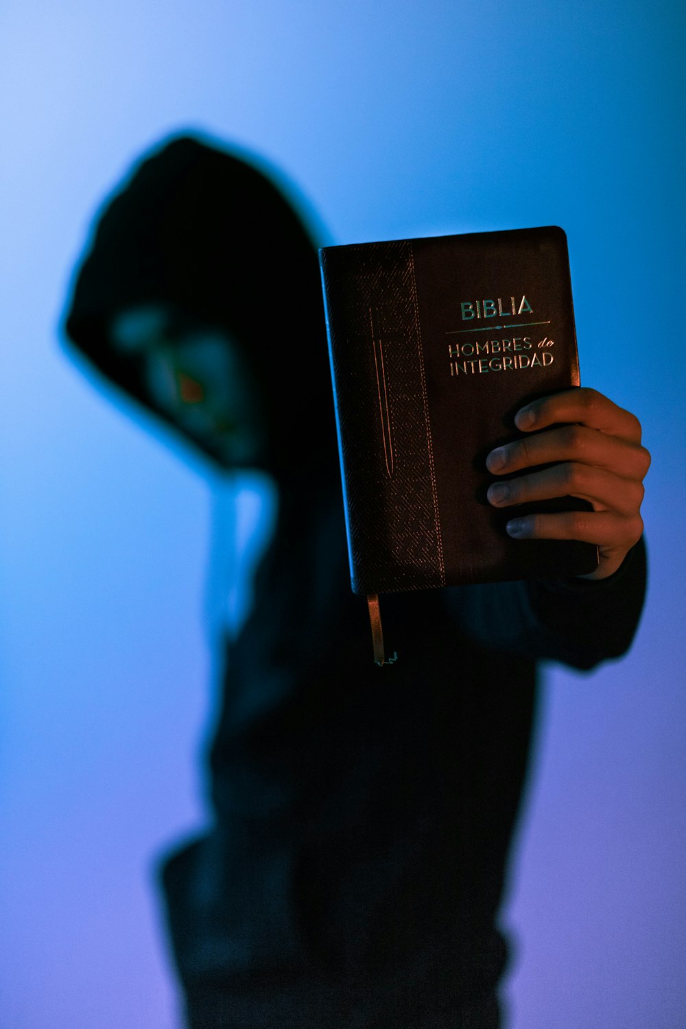 man holding Bible