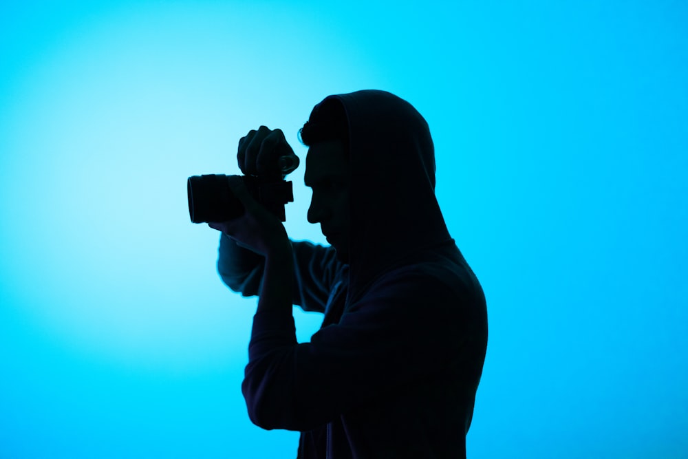 man taking photo using camera