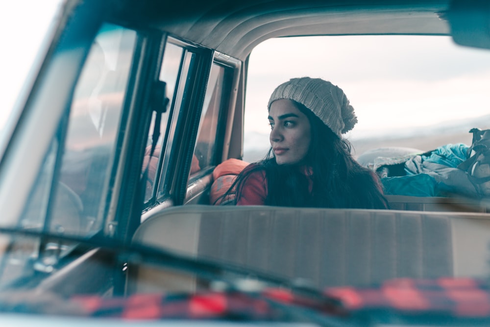 woman sitting on vehicle seat