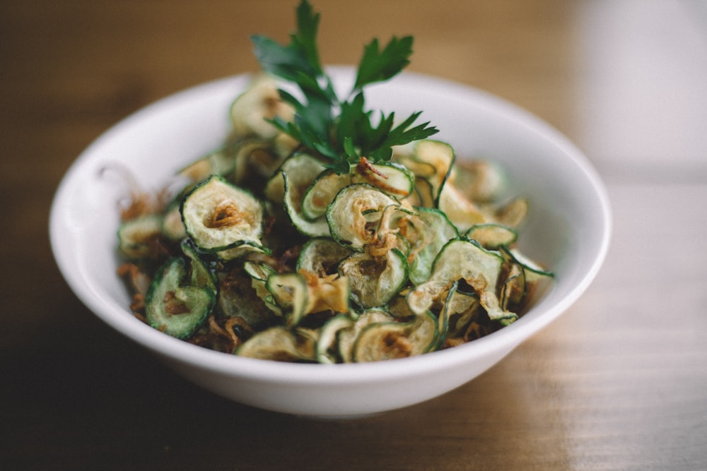 selective focus photography of salad on white bowl