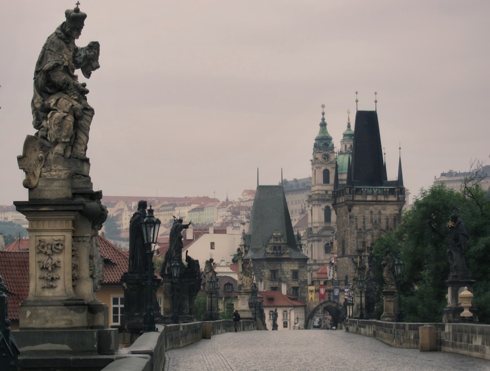 concrete bridge with statues on side