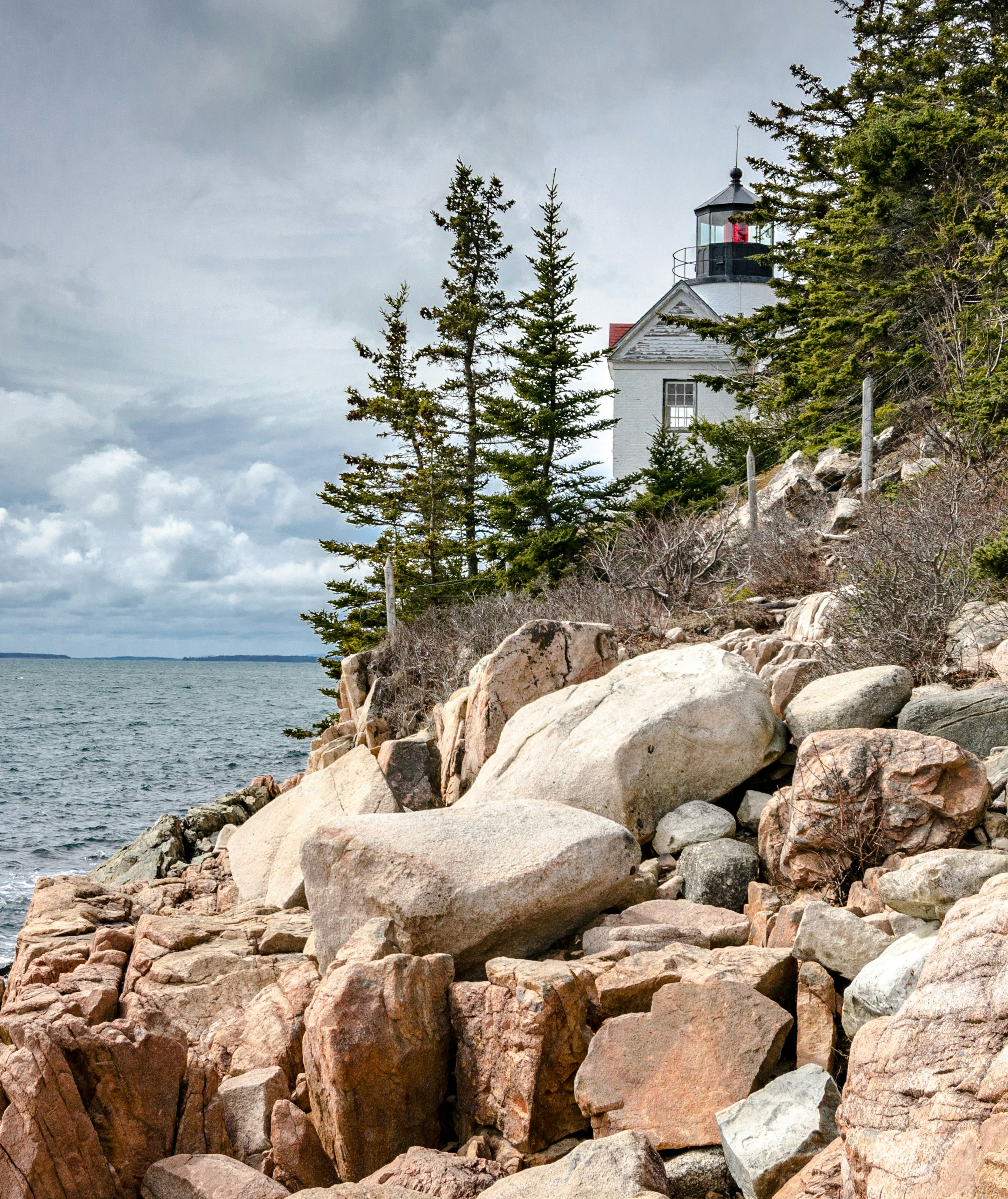 white concrete house near body of water
