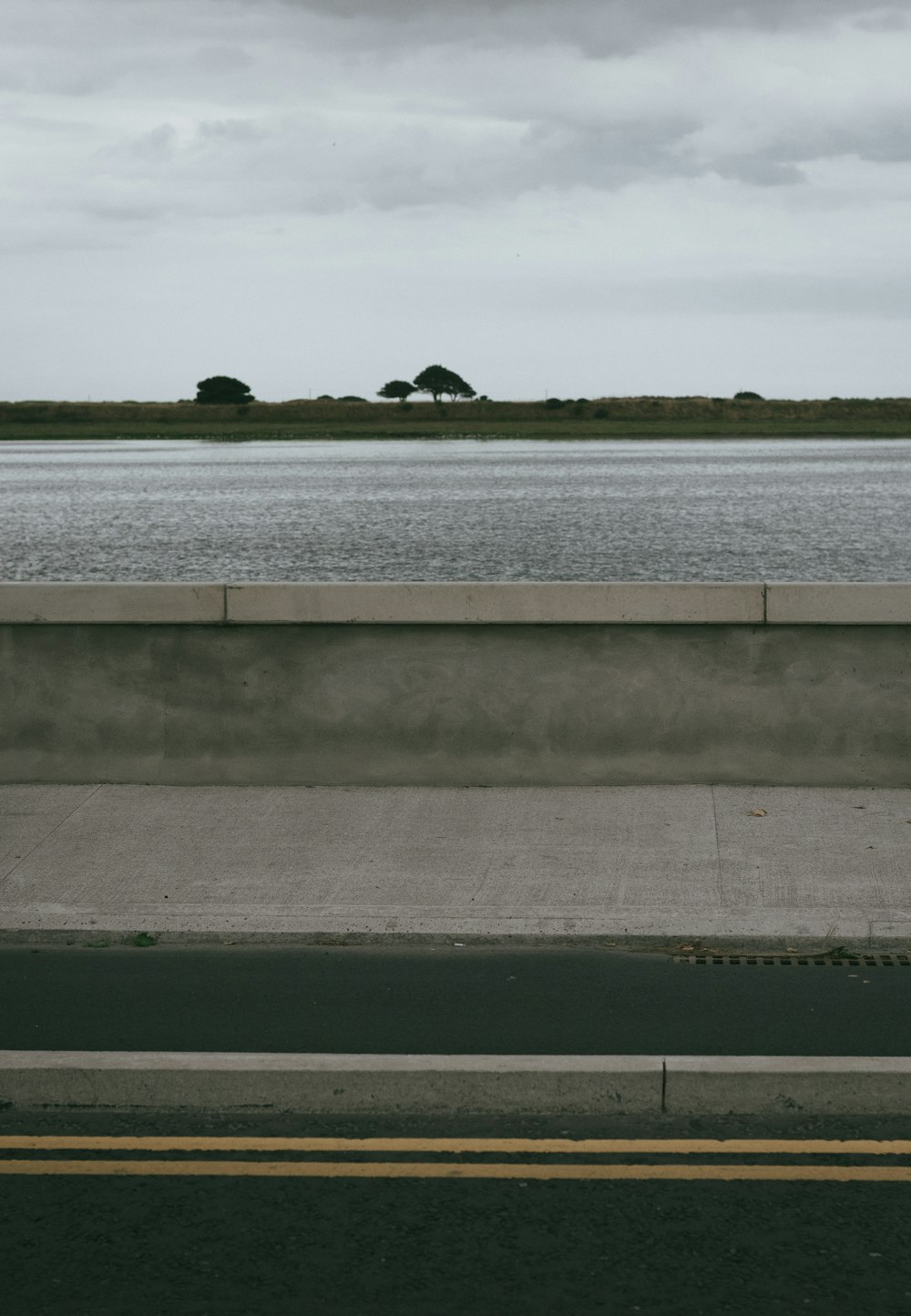 gray concrete road guard rail