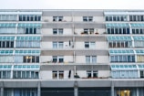A residential building facade with balconies and glass windows in Dubai.