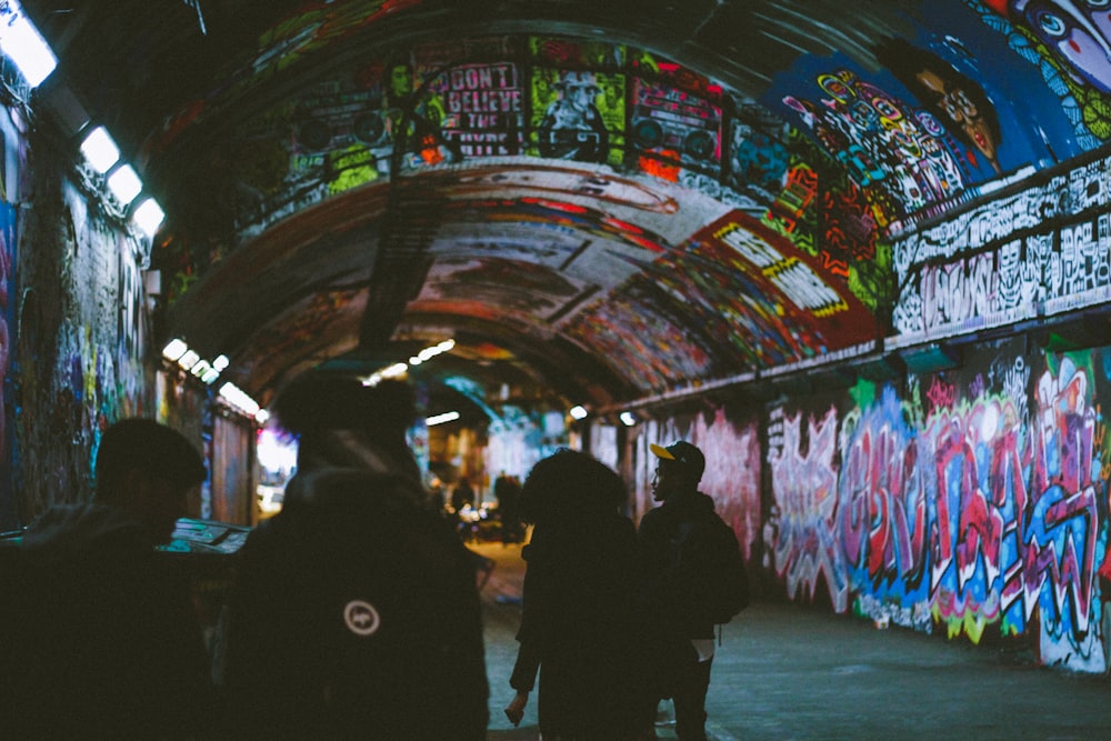 people walking in tunnel