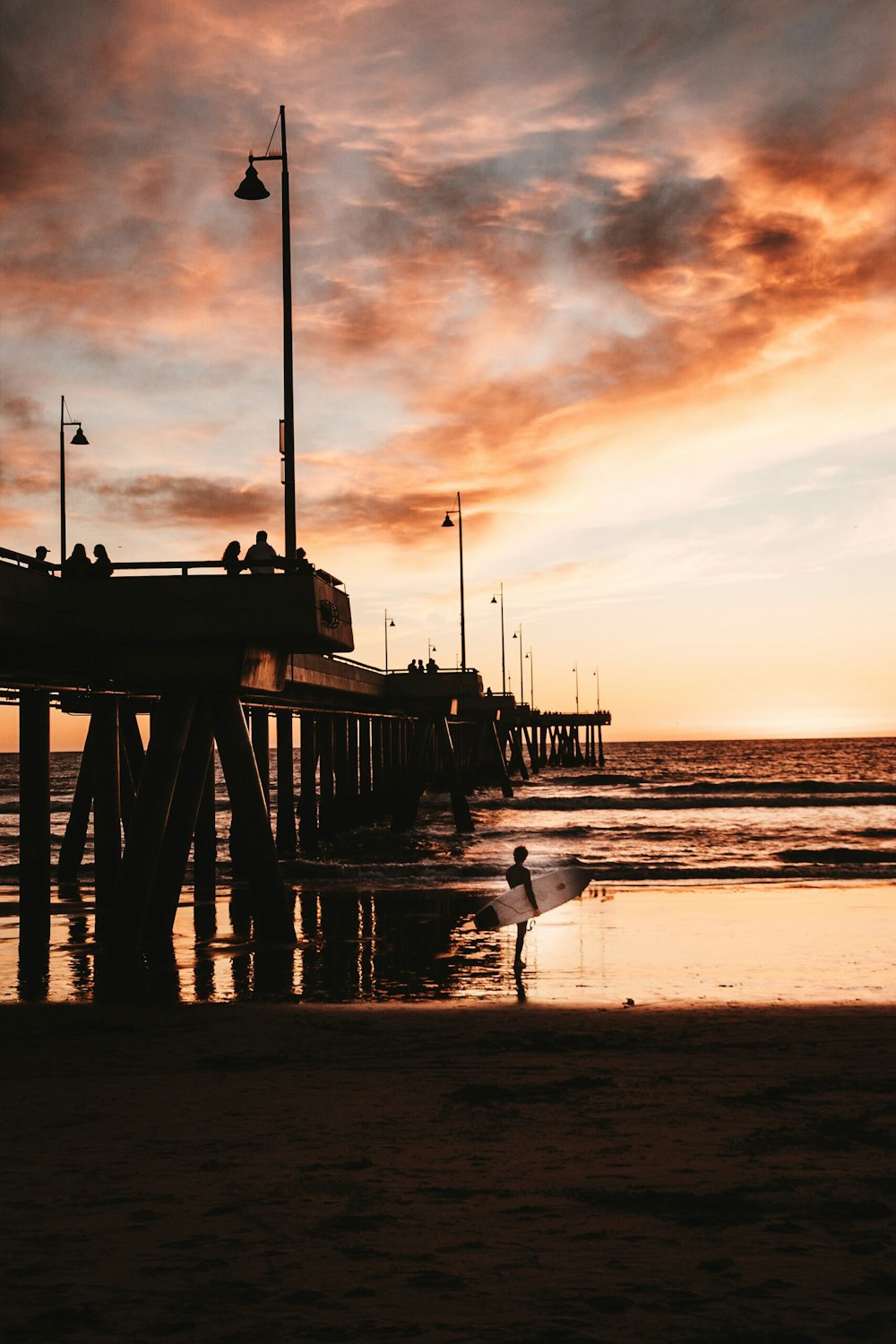 dock in the beach during golden hour