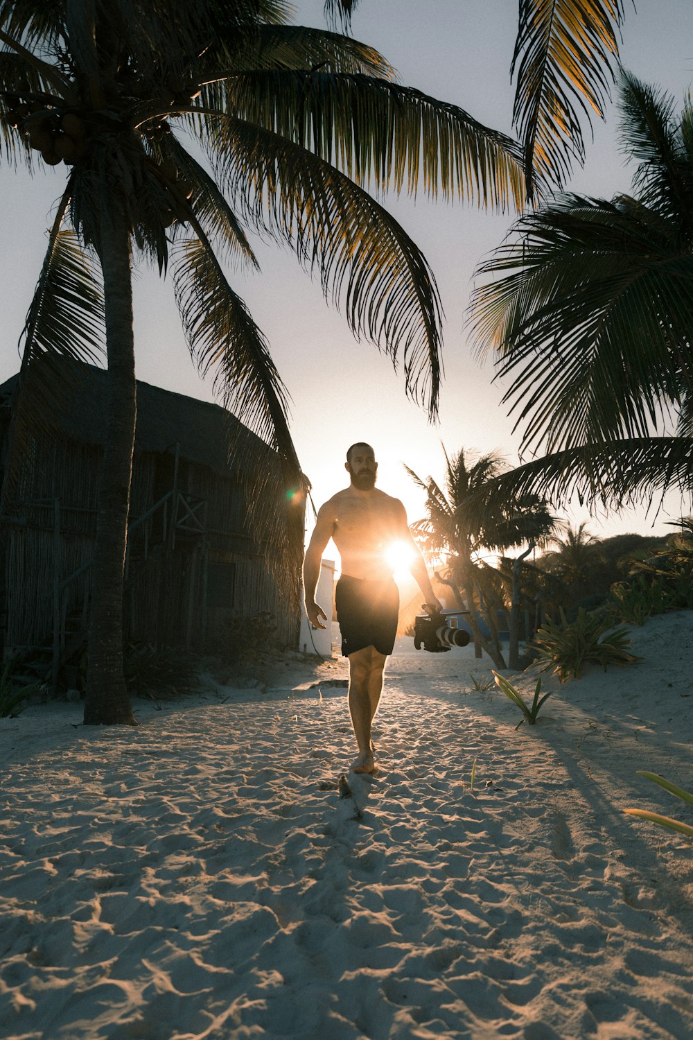 man walking on beach seashore