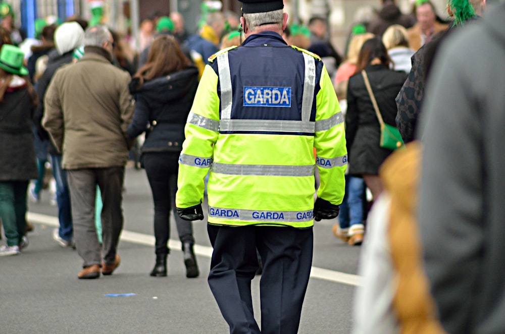 man wearing green and black police suit