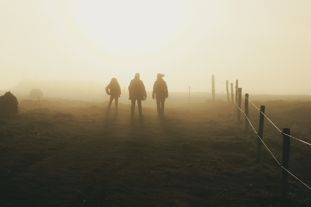 three silhouette of person walking photo – Free Cantal Image on Unsplash