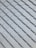 A close-up view of a pattern made up of overlapping rectangular tiles, creating a textured and uniform appearance. The tiles are arranged in a diagonal grid and are made of a smooth material.