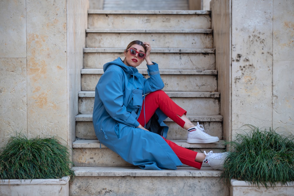 woman sitting on concrete stairs