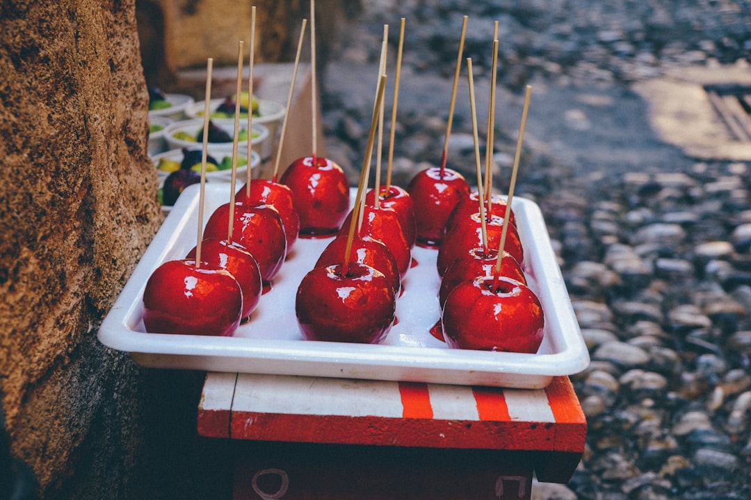 skewered red fruits on white tray