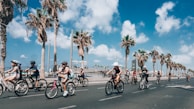 Friends cycling along a coastal path, wind in their hair and smiles all around.