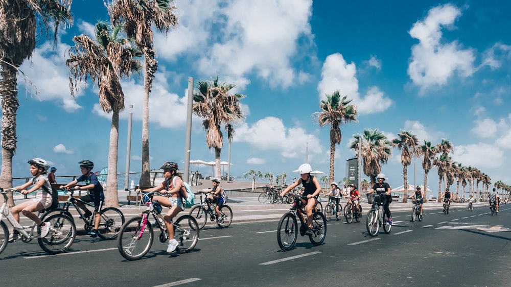 people riding on bike crossing road