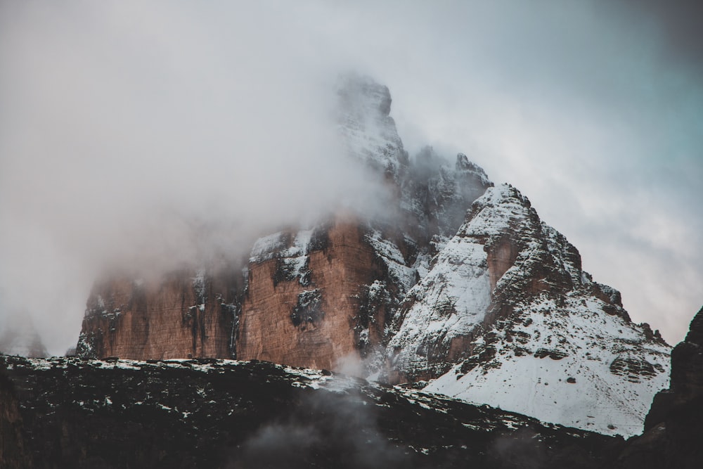 nature photography of mountain covered by fogs